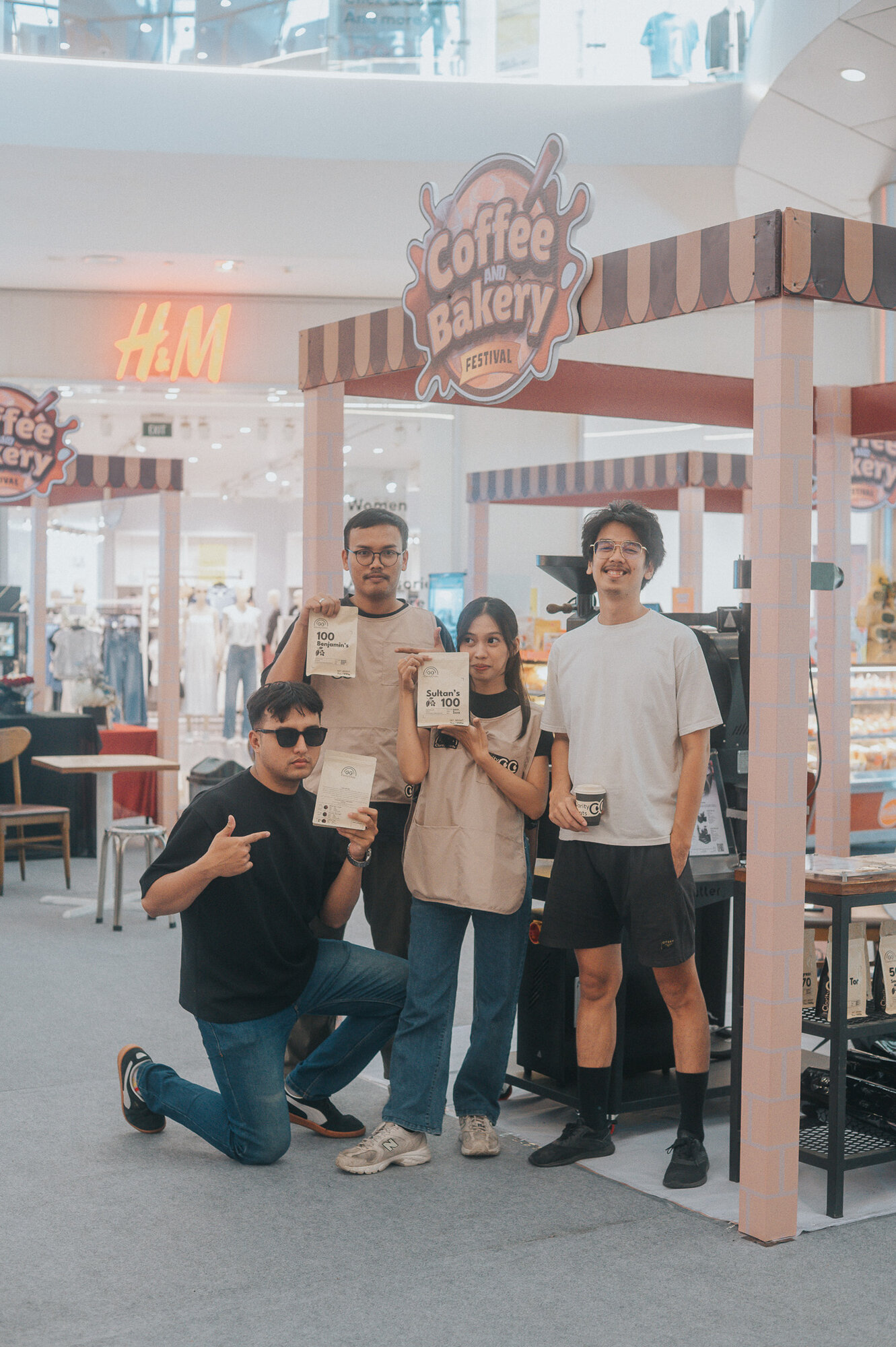 Team members in casual pose at festival