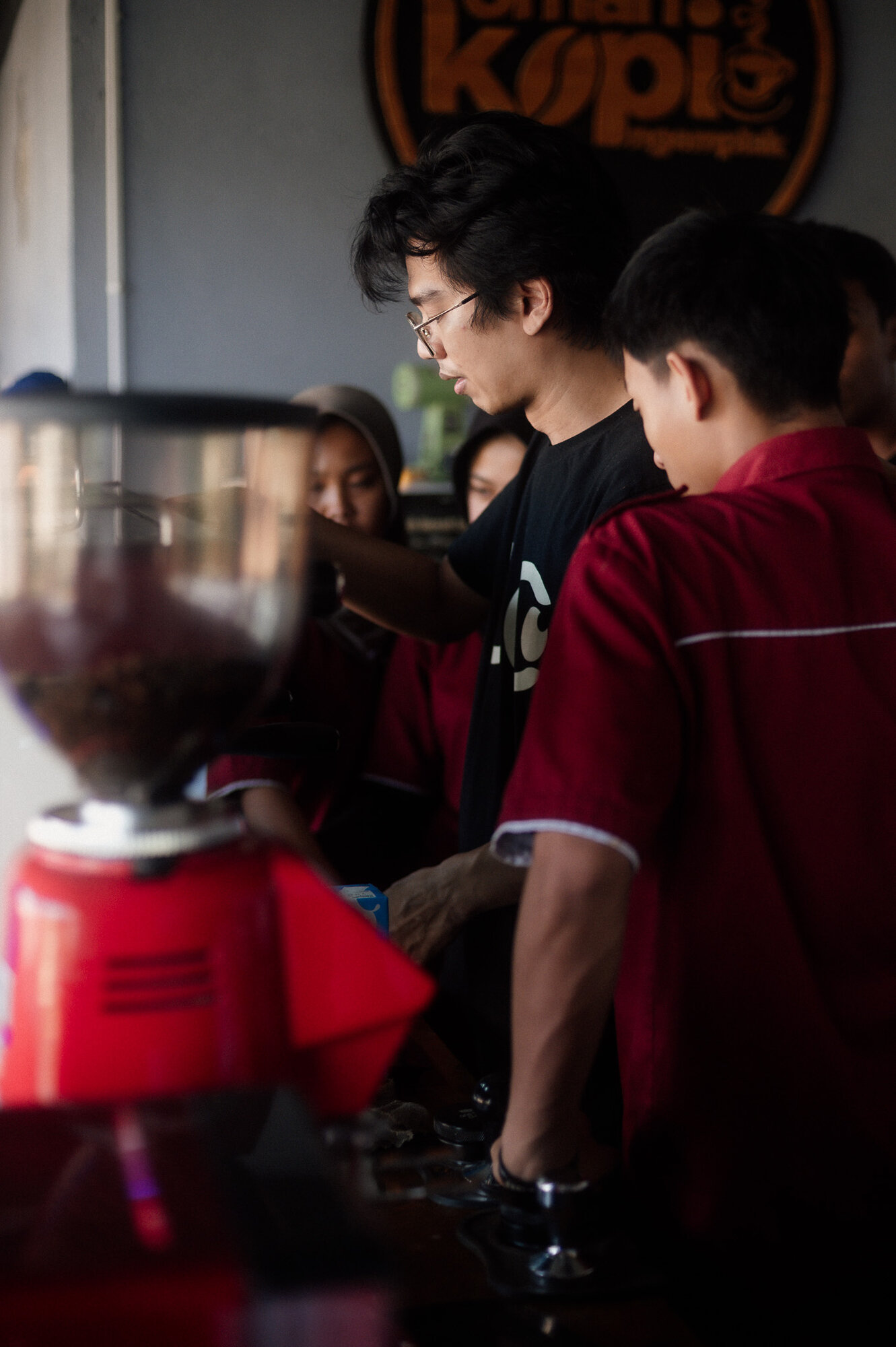 Students practicing barista skills in training